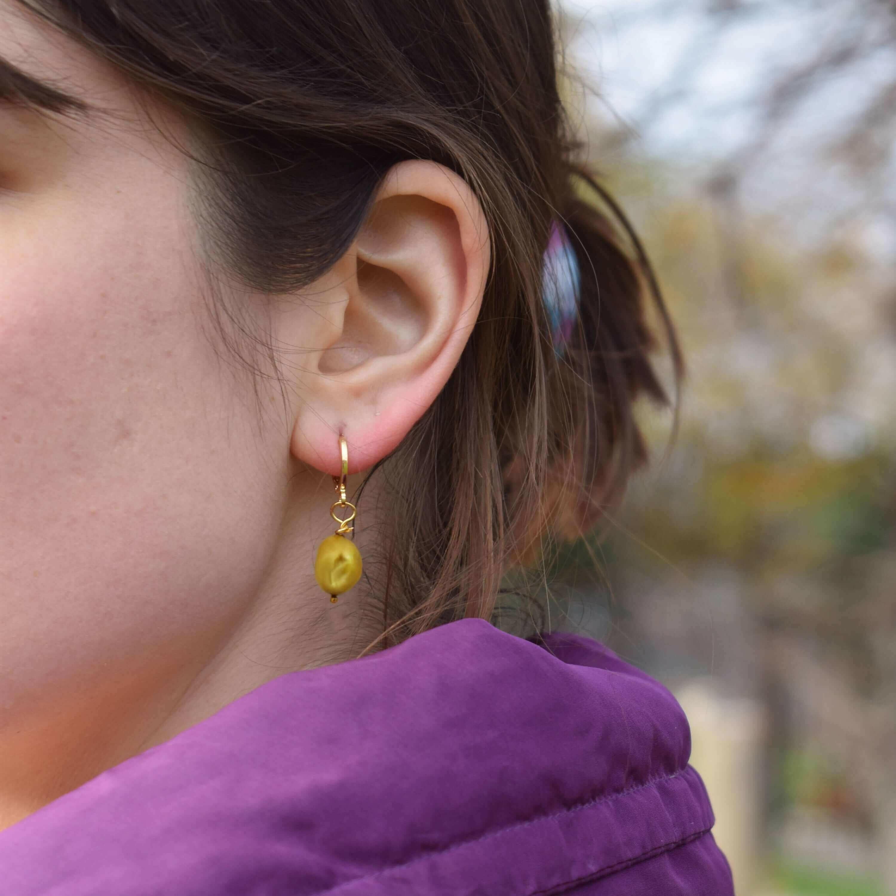 Gold freshwater pearl huggie hoop earrings | by Ifemi Jewels