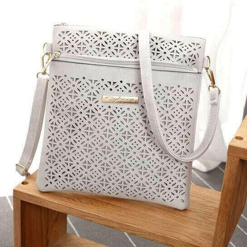 Blossomita Handbag With Cutout Flower Design.