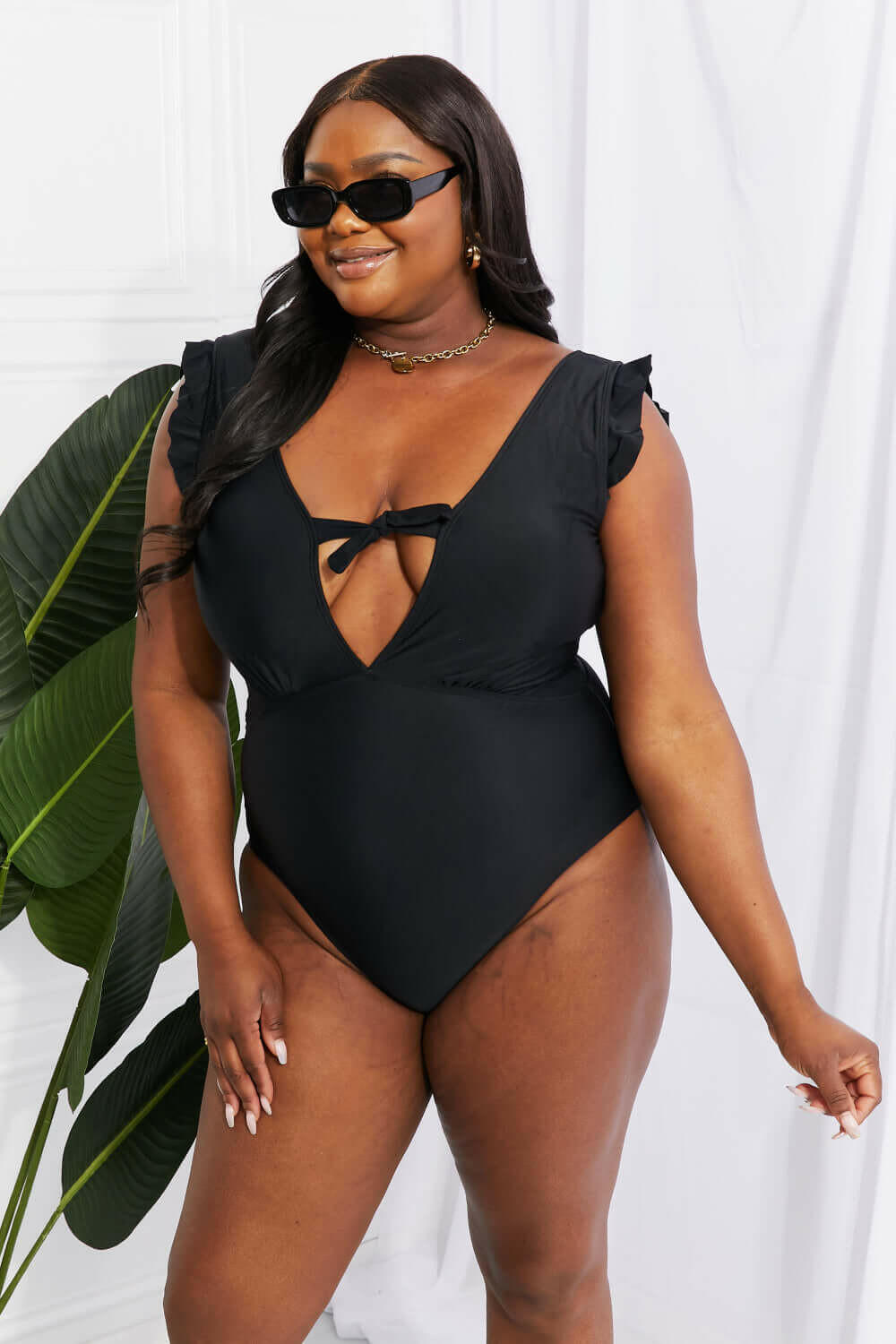 Marina West Swim Seashell Ruffle Sleeve One-Piece in Black.