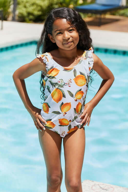 Marina West Swim Float On Ruffled One-Piece in Citrus Orange.