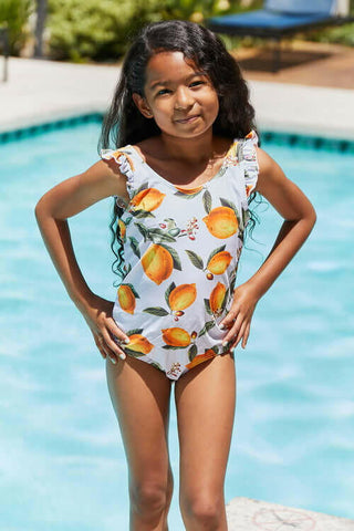 Marina West Swim Float On Ruffled One-Piece in Citrus Orange.