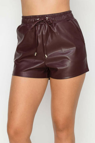 Pocketed High-rise Faux Leather Shorts.