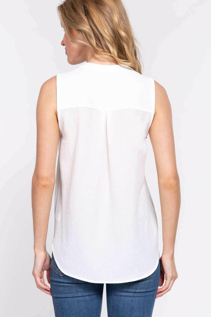 Sleeveless Henley Neck Woven Top.