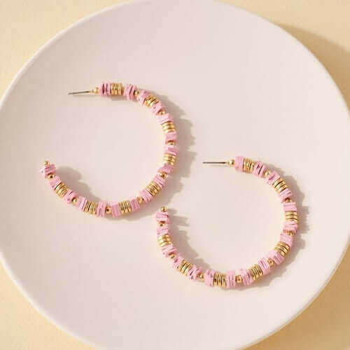 Rubber and Metal Disc Hoop Earrings.