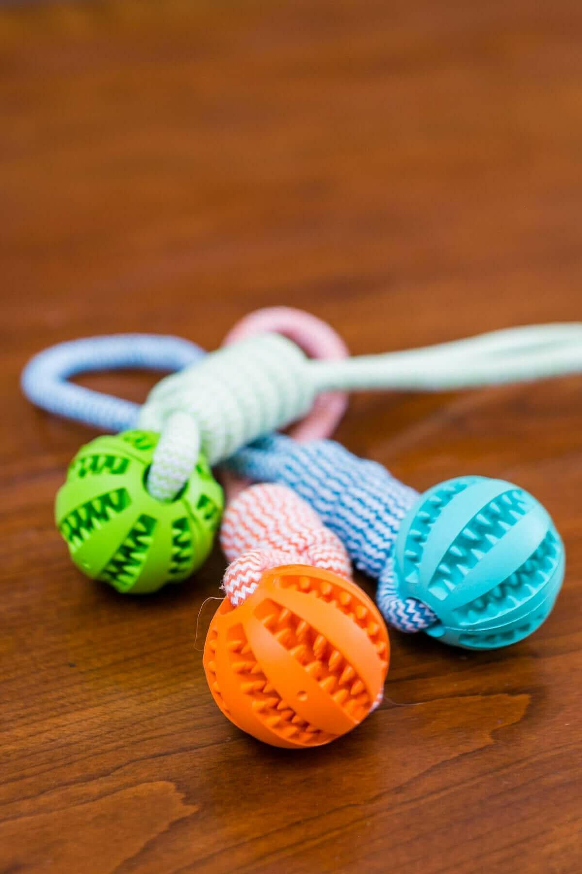 Durable Rubber Ball Chew Toy with Cotton Rope.