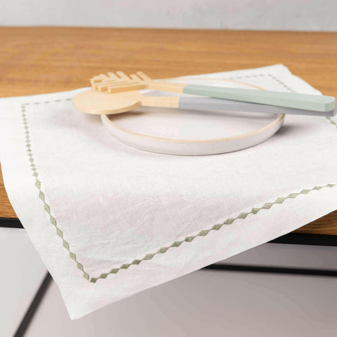 Embroidered hemp placemat, white.